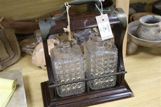 A Victorian oak two-decanter tantalus height 34cm